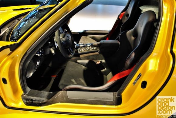 I no its not a GT3 and it's not the same yellow, but it gives an idea of what red stitching/belts look like on a yellow car.