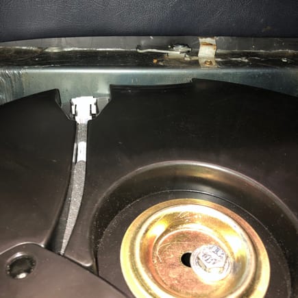 The depth of the trunk well is about 6". The sub box is about 5" deep. Here you can see it sits about .5" below the trunk floor with the .5" OEM rubber spacers below. 