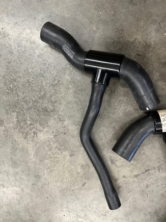 The street Supply hose, 996-106-666-56.  If you add one of the adapter hoses sourced from the GT2 parts bin, you can actually make up this hose (thankfully!).  The challenge I see is that there is no part number in PET for the metal hose that serves as a joiner between the street hose and the GT2 center radiator adapter hose.  McMaster-Carr may be a possibility?