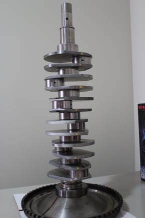 GT3 Crankshaft..  There are alot of differences between this and the stock crank:  The main one being this is a fully counterweighted crank, whick actually increases the weight over the stock unit by approx 2.5lbs.