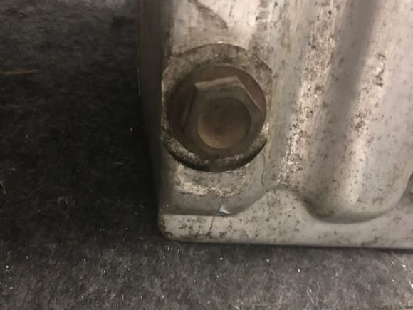 Is the oil pan double walled by chance - as seen below this bolt?