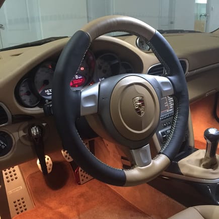 New, thicker two-tone sport steering wheel