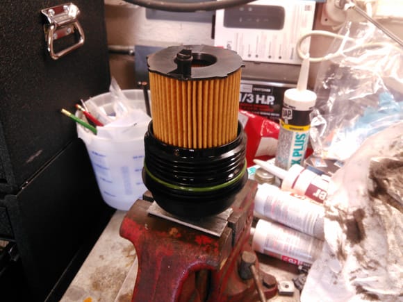 New oil filter with locating pin