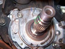 This is a view of the crankshaft bearing carrier and crankshaft end, taken from inside the right front wheel well. 
The blue line shows the location of the timing mark on the corner of the cast rib.
The green box outlines the splines on the crank which have been joined at the end to make a double spline 'key' for the timing belt pulley.