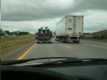 Cloudy day on I275 North in the hammer lane following a DPW truck illegally running the hammer lane.