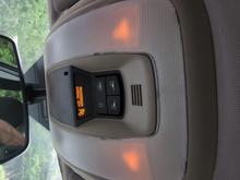 Doors are closed and in Drive.  The light should be off, but it is dimly on.