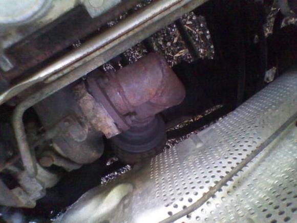 this has to be my favorite redneck fix of all time it works kinda there are 3 90s on this fixed up down pipe... I hope that my turbo isnt fried.... but that is cool if it is I have found 2 more turbos for it.....