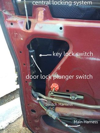 This is the overall view of the driver's door with the central lock components.  The key lock switch is hidden in the shadows but is shown in the next picture.  Oddly, only the wiring on the switch harness is affected.  The main harness insulation is bright, shiny, and pliant.