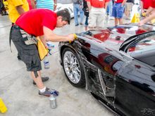 The guys from Clear Auto Bra are installing XPEL ULTIMATE on the front fenders