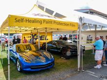 The blue Corvette is sitting under our XPEL tent, awaiting its owner to pick it up