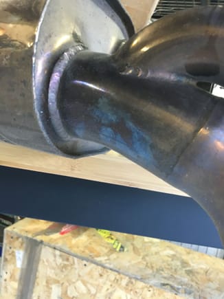 An exhaust system that has some bluing on the exit from the canister with no bend at all