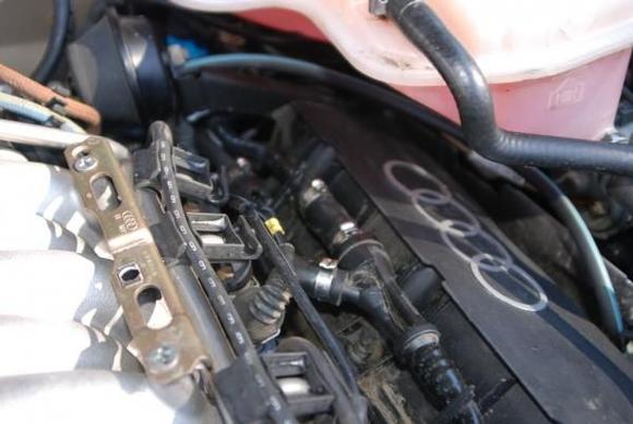 Hose Runs along top of engine.  Looks like it connects to Brake Master Cylinder