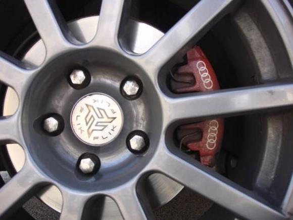 Rim with painted caliper on front.