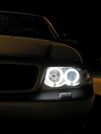 Blacked out grill, SONAR chrome headlights with Angel Eyes.