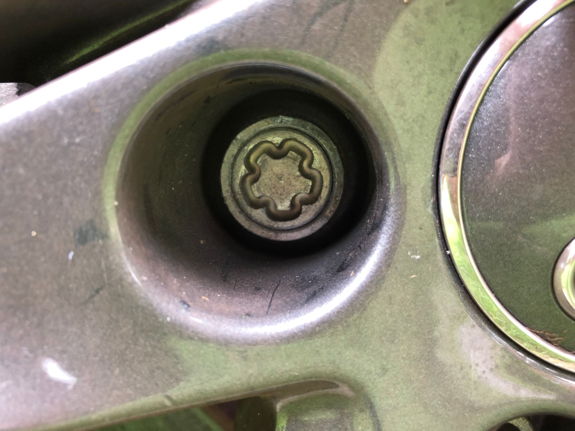 I've lost my locking wheel nut key — how can I change a flat tyre?