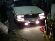 These were from when I added the fog lights.

A pic inside the shop with what comes one when I turn on low beams (after I rewired everything) - 55w halogen low beams, 50w halogen fog lamps, 50w halogen corner lamp in place of the low wattage 886 running light, low wattage side of the incadescent turn signal bulb, and the low wattage 886 bulb in the side marker.
