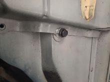 The one bolt from the factory was backed out from the inside and placed back in from the outside.