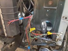 Heres the wires from the PDC. Its gauged appropriately and color matched to the OEM wires going into what used to be the H4 harness. Ypu can also see the terminals for the fog light relay. Right here between the OEM harness and the auxiliary PDC is going to be a connector.