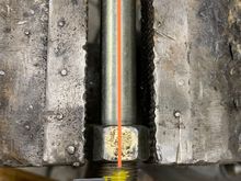 Move over to the beach vise. Thread a spare nut past where the hole will end up. Align the bolt so that the hole will be inline with a flat on the bolt head hex. This is important for drilling, you’ll see why.