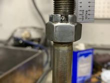 Now is a good time to spin your castle nut on and make sure the hole aligns properly thru the bolt.