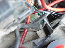 This is the splice, where the main GND from the alternator is spliced into the main NEG wire from the battery to the engine block GND location.