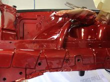 This shows the beginnings of the roll cage., Just before paint I bent and welded in the beginnings of a roll cage, started with a  tube from the newly supported frame rail. connected it up along the spring perch.  Turned it at the upper edge of the inner fender and ran it back toward the firewall.