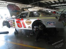 Me doing my job under the 51 @ Pikes Peak Intl. Raceway in Colorado. Our 57 car is parked right past this one in the same garage.