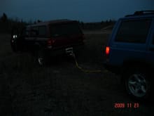 jeep pulling ford...he high centered....