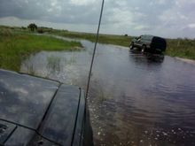 My cusin an me getting futher out I know it looks like a river