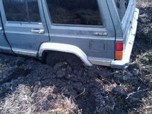 we finally figured it out back her up put some logs in the rut and give her heII