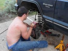 Trying to pry the coil spring out.