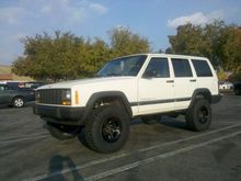 Stock 15x7 rims painted black with Goodyear Duratrac 31x10.5r15 tires.