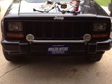 Made my own light bar... I welded quarters on the ends of the pipe to keep the water and junk out :) Two more bigger ones will go in the middle.
