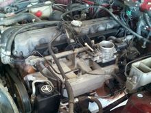 engine bay before tearing the manifold out