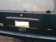 Any chance I get, I like to reduce my weight, so since my rear wiper quit working, I removed everything and put this nice little emblem in its place. It is the center of the steering wheel/horn button from a 93 Cherokee.