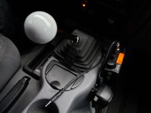 I have the AUX cord coming out a hole in the shift boot.
