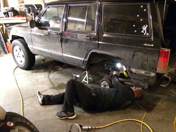 So it was time for a little lift.  2" budget lift.  Shackles in the back.  Pucks in the front.  New shocks all around.
Of course 3 of the 4 upper shock bolts broke off...