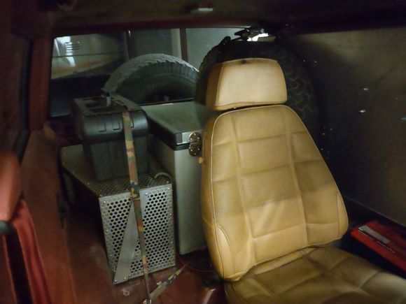 Aluminum Storge compartment to the left of this 3rd seat that is centered.
Directly behind the seat is the Wytner tall and narrow refirigerator and freezer, WORKS PERFERCT!