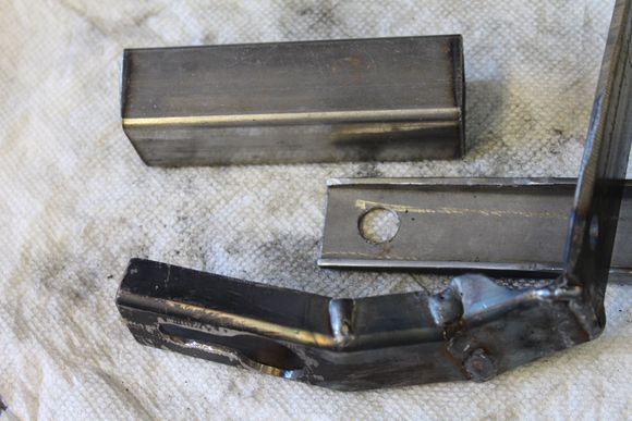 I started some "eyeball engineering"
The bracket started by shaping and slotting square tubing.