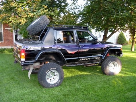 dingus......this guy should be punched for having a gaying up this cherokee.....but since he put the money into the nicly fitted topper and rack...he can slide