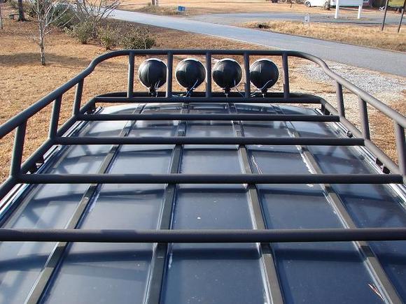 Top facing forward.  Rack actually is about 3/8 of an inch off top of roof in center.  Roof is not flat.
