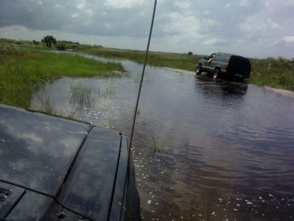 My cusin an me getting futher out I know it looks like a river