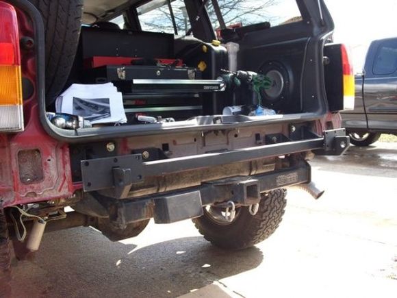 The lower cross member attaches to the L-brackets and the inner cross member.  Everything else attaches to this. It comes with d-ring recovery points and these require 2 cuts to be made to the stock bumper.