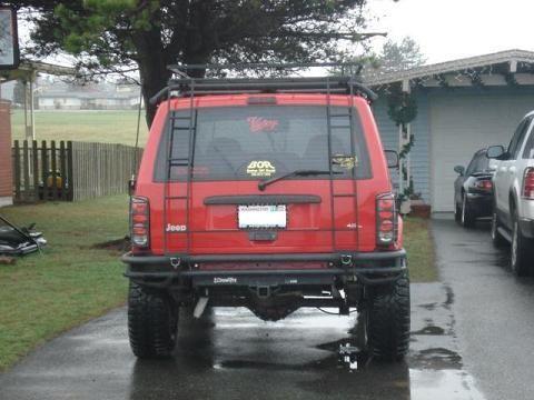 After the ladder set-up was complete I started working on the rear area behind the bumper.  It's painted black and cleaned up my wires for the trailer hitch, drilled and mounted that onto the bumper.