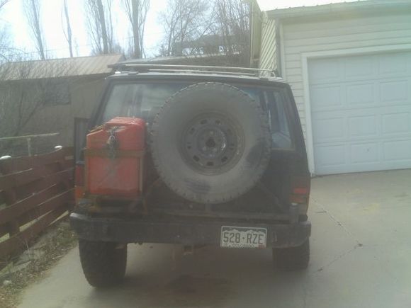 rear bumper, with spare and gas tanks on swing arm