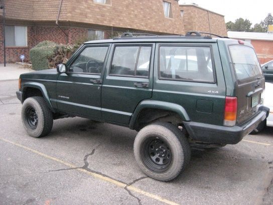 Side view, the total lift i have now is 4.75 in front and 5 " in back. Bastard pack in back with toyota tacoma springs and a 2" shackle.