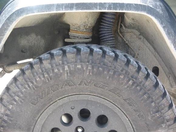 Here is the custom spacer to bring the front more even with the rear.  Bastard pack got rear to 4.75" of lift when front was only 3".  Added a second stock isolator but still felt too downhill, so had the shop where I work cut this 1/2" steel spacer.  I should have painted it before install but I'm not taking it out now just for paint!  I may rattle can it in place though...