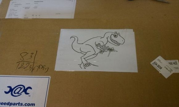 Asked them to "draw a dinosaur with a machine gun" on the box.