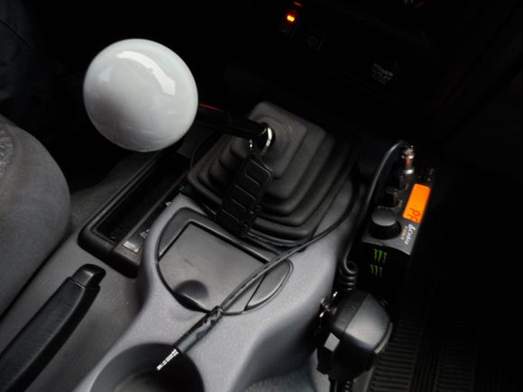 I have the AUX cord coming out a hole in the shift boot.