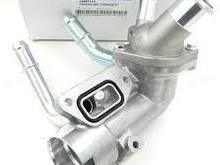 This photo shows the engine side of the housing, note the groove for the seal and those two bolt holes , then that other hole below the pipe housing 